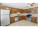 Kitchen with stainless steel appliances, tile backsplash, and ample countertop space at 543 Harbor Lake Ct, Marietta, GA 30066