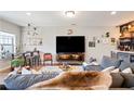 Inviting living room with a sectional sofa, decorative bar, and entertainment center at 10162 Windalier Way, Roswell, GA 30076