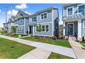 Beautifully landscaped new construction home with modern blue exterior, offering a pristine curb appeal at 1937 Quarry Park Nw Pl, Atlanta, GA 30318