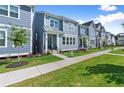 Desirable new construction with blue siding, neat landscaping, and easy sidewalk access at 1937 Quarry Park Nw Pl, Atlanta, GA 30318