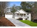 Beautiful exterior of a home, showing the driveway, front yard, and covered porch at 348 Lakemoore Ne Dr, Atlanta, GA 30342