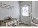 Inviting entryway with a decorative table and a 'Home Sweet Home' sign at 495 Stambridge Ct, Johns Creek, GA 30005