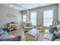Cozy living room featuring stylish furnishings and plenty of natural light at 495 Stambridge Ct, Johns Creek, GA 30005