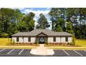 Community clubhouse with lush landscaping, ample parking and elegant architectural details at 5417 Flat Rock Point, Stonecrest, GA 30038
