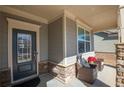 Inviting front porch with comfortable seating and stylish stone accents at 351 Clay St, Grayson, GA 30017