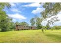 Well-maintained brick home with a sprawling green lawn and charming curb appeal at 5255 Post Rd, Winston, GA 30187