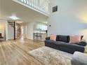 Open-concept living area showcasing a spiral staircase and sleek hardwood floors at 3465 Jones Ferry Ln, Alpharetta, GA 30022