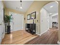 Inviting foyer with gleaming hardwood floors, a stylish console table, and an arched doorway at 129 Windy Cir, Mcdonough, GA 30253