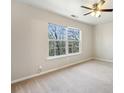 A bright bedroom with a large window overlooking the yard at 622 Providence Sw Pl, Atlanta, GA 30331
