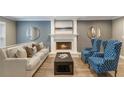 Inviting living room with a cozy fireplace, complemented by elegant furniture at 3186 Quail Ct, Decatur, GA 30034