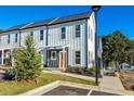 Modern townhome exterior showcasing well-maintained landscaping, clean architectural lines, and a private entrance at 697 Fayetteville Rd # 303, Atlanta, GA 30316