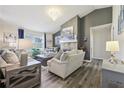 Bright living room with modern furnishings and a stone fireplace at 509 Chestnut Oak Dr, Palmetto, GA 30268