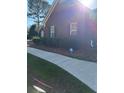 Brick home with lush landscaping and secure alarm system at 625 Huiet Dr, Mcdonough, GA 30252