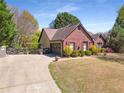 A well-maintained house with beautiful landscaping and a two-car garage at 1252 Highfield Dr, Lawrenceville, GA 30043