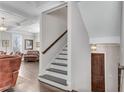 Elegant foyer with hardwood floors, coffered ceilings, and staircase with wood railing at 2880 Stonehall Ct # 2, Atlanta, GA 30339