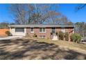 Traditional home with brick accents and a neatly landscaped front lawn at 3140 Westmart Ln, Atlanta, GA 30340