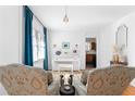 Cozy living room with a white piano, hardwood floors, and ample natural light at 3140 Westmart Ln, Atlanta, GA 30340