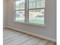 Bright living room featuring a large double windows and views of the neighborhood at 308 Moab Ct, Stockbridge, GA 30281