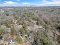 An aerial view of a neighborhood showing a skyline with a treelined view in a suburban area at 1038 Orlando Sw Pl, Atlanta, GA 30311