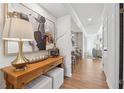 Stylish hallway showcases a wooden console table, decor, and leads to the living room at 886 Cedar Creek Se Ct, Marietta, GA 30067