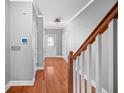 View of the entryway displaying hardwood floors, neutral walls, and white trim at 1094 N Village Dr, Decatur, GA 30032