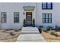 Charming townhouse with a brick facade and a covered front entrance with a dark wood door at 3601 Ridgeway Rd, Duluth, GA 30096