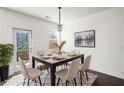 Dining room featuring modern table, chandelier, decorative rug and access to the back porch at 813 Whittington Sw Pkwy, Marietta, GA 30060