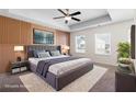 Spacious main bedroom with decorative accent wall, tray ceiling, and large bed at 813 Whittington Sw Pkwy, Marietta, GA 30060
