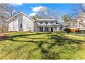 Beautifully landscaped front yard showcasing the home's facade at 180 Stone Mill Trl, Atlanta, GA 30328