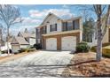 Charming two-story home featuring a two car garage and beautiful stone facade at 5232 Centennial Hill Nw Dr, Acworth, GA 30102