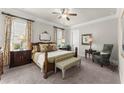 Cozy bedroom with neutral decor, plush carpeting, and ample natural light at 336 Little Pine Ln, Woodstock, GA 30188