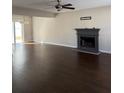Spacious living room features hardwood floors and a cozy fireplace at 5891 Raven Ln, Lithonia, GA 30058