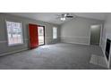 Spacious living room with large windows and neutral walls, bathed in natural light at 1343 Willow Sw Trl, Atlanta, GA 30311