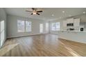 Kitchen and living area with open concept, stainless steel appliances, and great natural light at 325 Heavenly Hollow Pl, Mcdonough, GA 30253