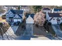 Bird's-eye view of a home with a two-car garage, showcasing its neighborhood setting at 1062 Glen Chase Dr, Lawrenceville, GA 30044