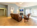 Cozy living room with vaulted ceilings, fireplace, and natural light from the door to the exterior at 1062 Glen Chase Dr, Lawrenceville, GA 30044