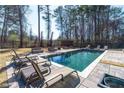 Swimming pool with lounge chairs and privacy fencing at 412 Ashwood Sw Ave, Atlanta, GA 30315