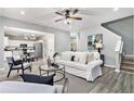 Inviting living room with an open concept, hardwood floors, and neutral colors at 885 Clairidge Ln, Lawrenceville, GA 30046