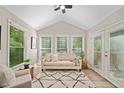 Cozy sunroom with ample natural light and neutral decor, perfect for relaxation and enjoyment at 1131 Mayfield Dr, Decatur, GA 30033