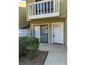 Home entrance featuring a white door, sliding glass door and green bushes at 731 Hanover Se Ln, Marietta, GA 30067