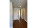 Hallway with tile floors leading to a stairway at 731 Hanover Se Ln, Marietta, GA 30067
