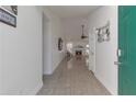 Bright foyer with tile flooring leading to the living area with fireplace, creating an inviting entrance at 1025 Grace Dr, Lawrenceville, GA 30043