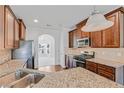 Beautiful kitchen with granite countertops, stainless steel appliances and dark wood cabinets at 1765 Stone Meadow Rd, Lithonia, GA 30058