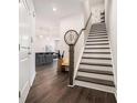 Inviting entryway with hardwood floors, a staircase, and modern decor leading into the home at 2978 Edgemont Ln, Marietta, GA 30008