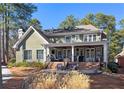 This home has a spacious outdoor living area with a large deck and patio at 9795 Terrace Lake Pointe, Roswell, GA 30076