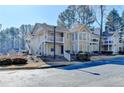 Beautiful condo with manicured landscaping, balconies, and plenty of parking at 309 Berkeley Woods Dr, Duluth, GA 30096