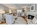 Bright living space with open concept to the dining room and modern design touches at 309 Berkeley Woods Dr, Duluth, GA 30096