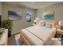 Comfortable, virtually staged bedroom featuring a cozy bed, decor, and natural light streaming through the window at 8120 Berrywood Ct, Covington, GA 30014