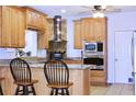Cozy kitchen with wooden cabinets, granite countertops, and stainless steel appliances at 3527 Kellogg Creek Rd, Acworth, GA 30102