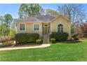 Inviting single-Gathering home with a well-maintained lawn and landscaped front yard at 5445 Mountain Trl, Douglasville, GA 30135